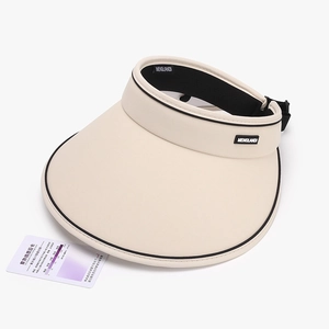 Beige UV protection sun visor with wide brim and sun intensity testing card