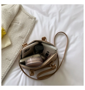 Top-down view of a brown seashell bag showing spacious interior for daily essentials