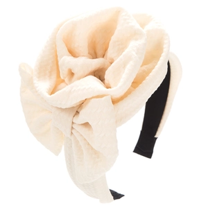 Detail of cream oversized floral headband featuring thick waffle textured fabric design
