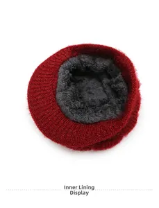Detailed view of winter knitted hat featuring thick grey plush fleece interior lining