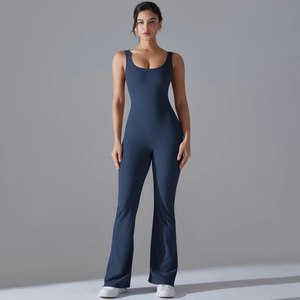 Close-up of deep blue flared yoga jumpsuit showing the high-elasticity matte fabric
