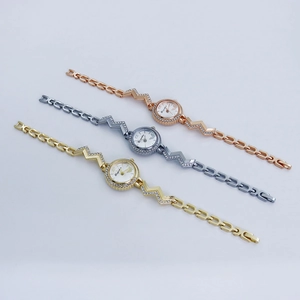 Detailed set of elegant quartz watches with sparkling crystals in gold, silver, and rose gold