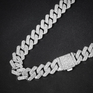 Macro shot of 14mm silver iced-out cuban link necklace with crystal pave and box clasp