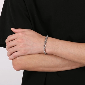Close-up of polished silver 8mm coffee bean chain necklace with minimalist metal links
