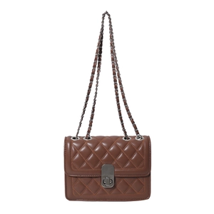 Brown quilted chain shoulder bag with silver metal lock on a clean white background