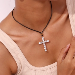 Minimalist 18K gold-plated stainless steel cross necklace with clear zircon and black cord
