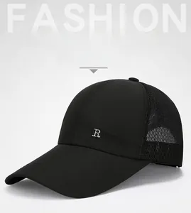 Detail of mesh back panels and embroidery on black breathable baseball cap