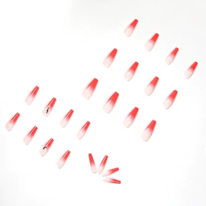 Faux ongles cercueil avec dégradé pêche, effet ombré rouge et accents de strass argentés