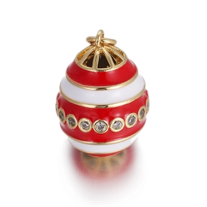Macro shot of red and white enamel egg pendant with sparkling white cubic zirconia