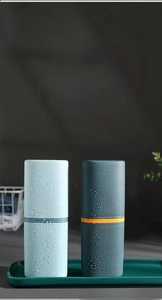 Detail view of portable toothbrush storage cases with sleek matte finish and contrast ring
