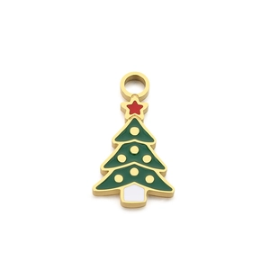 Green enamel Christmas tree pendant with gold trim and a red star on white background