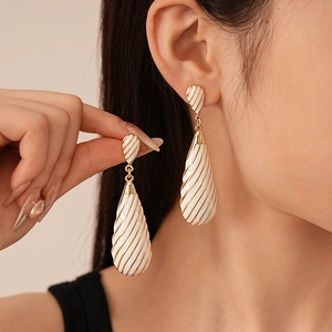 Vintage zebra stripe water drop earrings with white spiral texture and golden edges