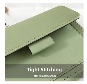 Detailed macro view showing the precise stitching and premium leather texture of the bag