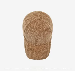 Top view of brown herringbone corduroy baseball cap with vintage textured fabric