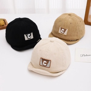 Corduroy baby baseball caps with Letter C patch in black, khaki and off-white colors