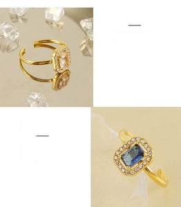 Detail of adjustable stainless steel rings with square zirconia and 18K gold plating