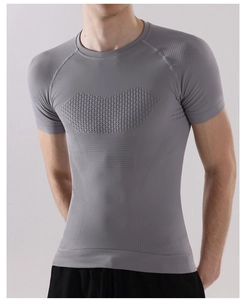 Detail of grey men's compression shirt showing breathable mesh and honeycomb texture