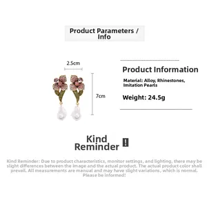 Detail shot showing flower earrings dimensions 2.5x7cm with rhinestones and faux pearls