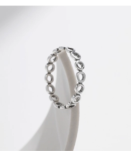 Macro shot of minimalist geometric S925 sterling silver ring with interlocking hollow circles