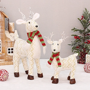 Pair of cream floral fabric reindeer statues with striped scarves for Christmas decor