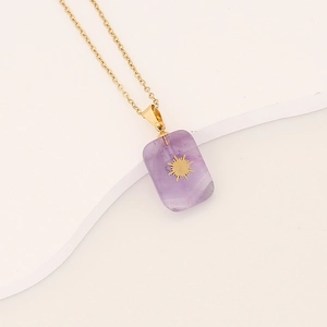 Close-up of gold lightning necklace with rectangular purple amethyst star pendant