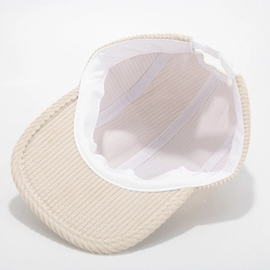 Detail view of corduroy baseball cap showing breathable mesh lining and adjustable strap