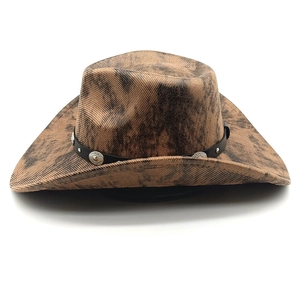 Detail of a brown marble western cowboy hat with leather band and silver studs