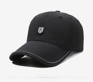 Macro detail of breathable quick-dry black baseball cap with R logo and reflective brim