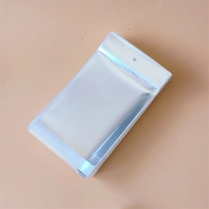 Close-up of stacked clear plastic OPP bags with hanging holes for jewelry packaging
