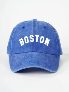 Detailed close-up of the washed blue cotton fabric and white BOSTON print on the baseball cap
