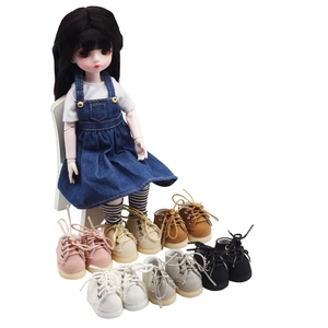 Close-up of assorted 20cm cotton doll sneakers in multiple colors on white background