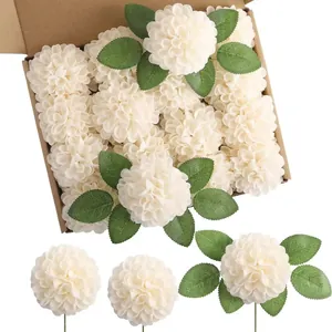 Macro detail of white foam dahlia artificial flowers with green leaves in a brown box