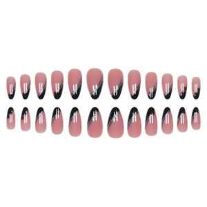 Nude pink almond press-on nails with black diagonal tips and silver glitter accents