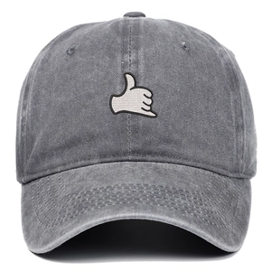 Detailed view of grey washed cotton baseball cap with white Shaka hand sign embroidery