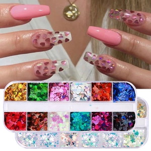 Detail of 12-grid nail art sequins box featuring laser glitter hearts and butterfly shapes
