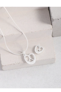 Detailed macro view of S925 sterling silver stamp on the heart knot jewelry set
