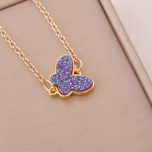Fashionable golden necklace with a glittering purple acrylic butterfly pendant for women