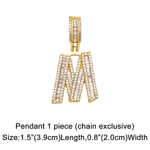 Detailed view of gold M-letter pendant with pave-set zircons measuring 1.5 by 0.8 inches