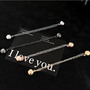 Adjustable magnetic t-shirt shortening clips in four metallic finishes on a card