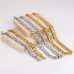Fashionable gold and silver stainless steel Cuban link bracelets on stones