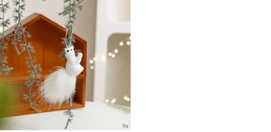 White faux fur squirrel ornament with a pinecone, dimensions showing 14cm by 6cm