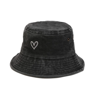 Vintage washed black cotton bucket hat with white heart embroidery and metal eyelets