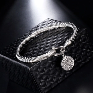 Polished stainless steel cable bracelet with St. Benedict medal on black leather box