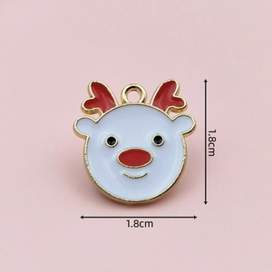 Detail of Christmas reindeer enamel charm with gold edges for DIY jewelry making