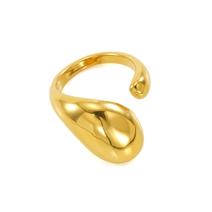 Macro detail of 18K gold-plated stainless steel ring with abstract teardrop fluid design