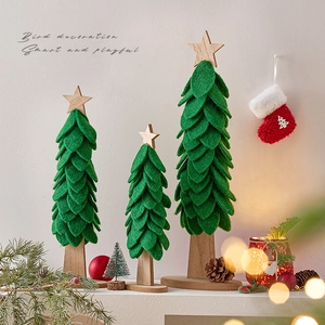 Three green felt Christmas tree desk ornaments with wooden bases for festive holiday decor