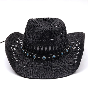 Detail of black woven cowboy hat with turquoise beads and silver stud band decoration