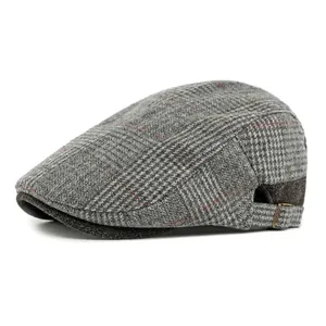 Vintage gray houndstooth newsboy cap with wool texture and red stripes for men