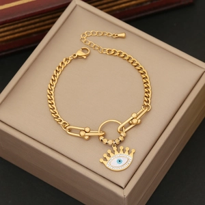 Golden Evil Eye bracelet with sparkling rhinestones on a jewelry box display