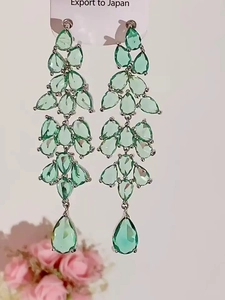 Detail view of light green leaf-shaped zircon drop tassel earrings for women